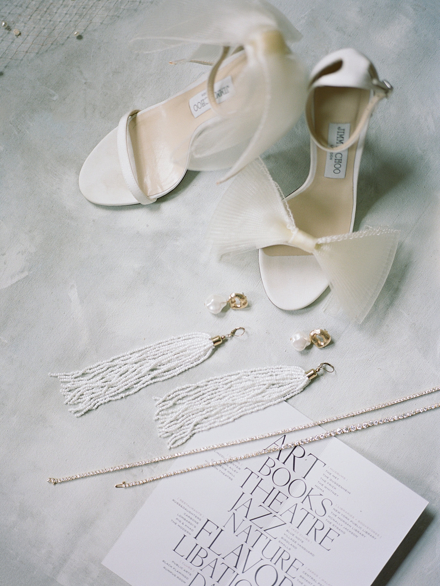 Bridal details and Jimmy Choo heels with beaded earrings | Photo by NYC Wedding Photographer Hope Helmuth
