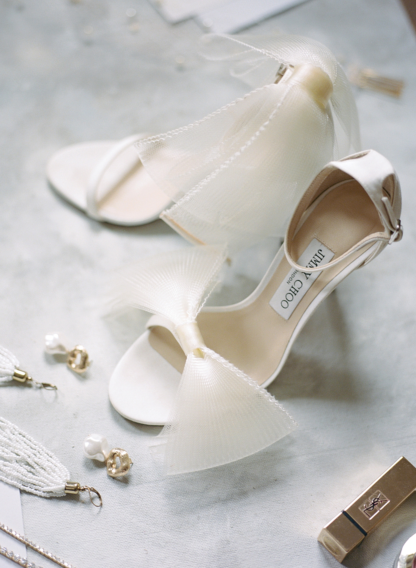White Jimmy Choo heels and YSL lipstick | Photo by Hope Helmuth Photography