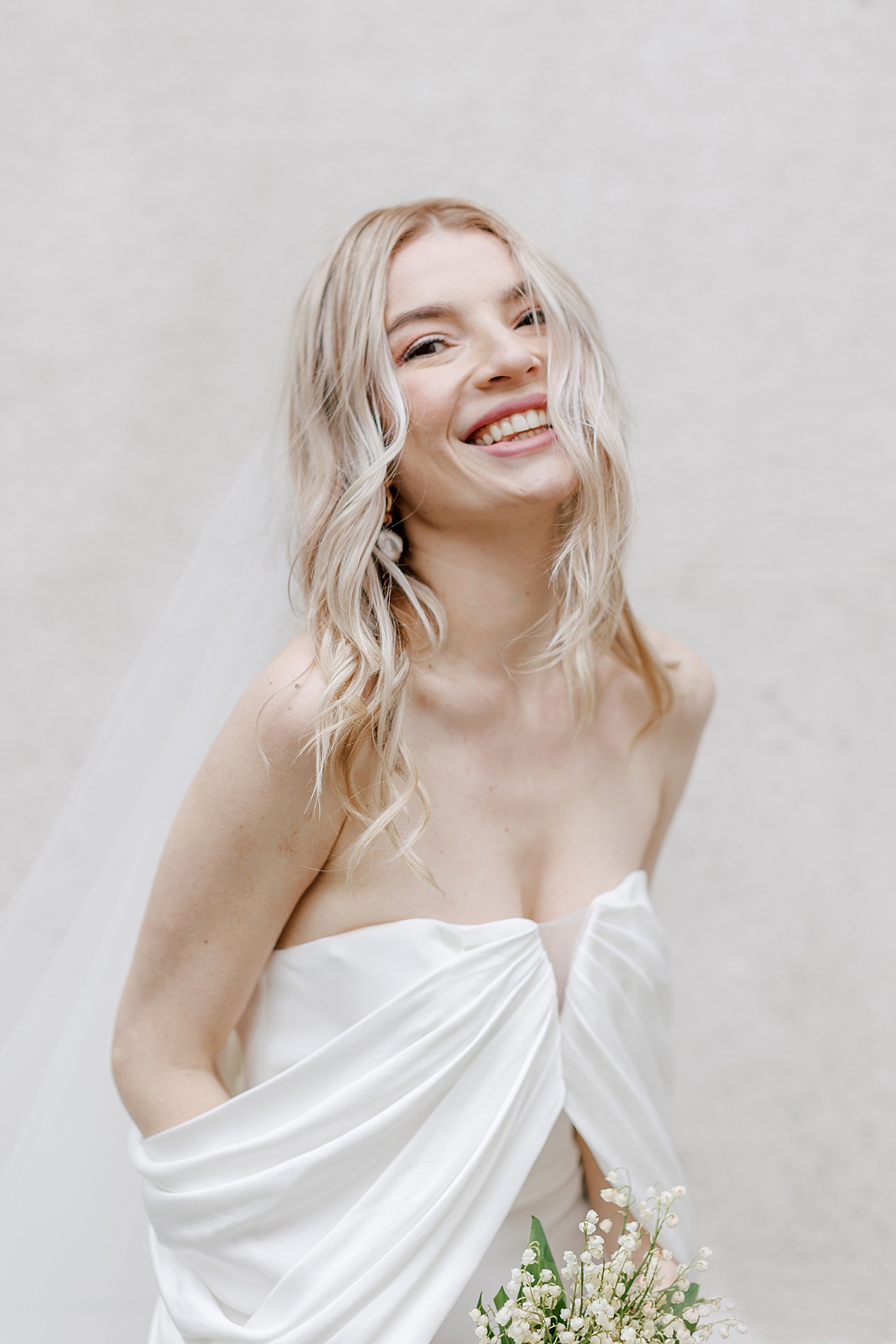 Bride smiling in a white gown | Photo by NYC Wedding Photographer Hope Helmuth