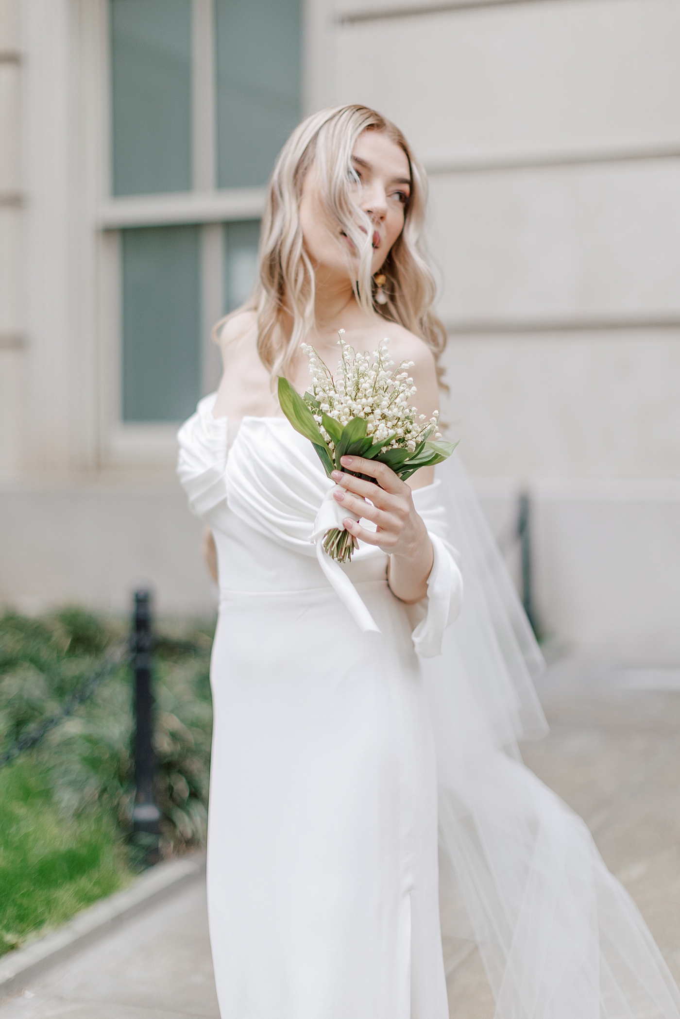 Whimsical bridal portrait of bride holding a bouquet | Photo by Hope Helmuth Photography