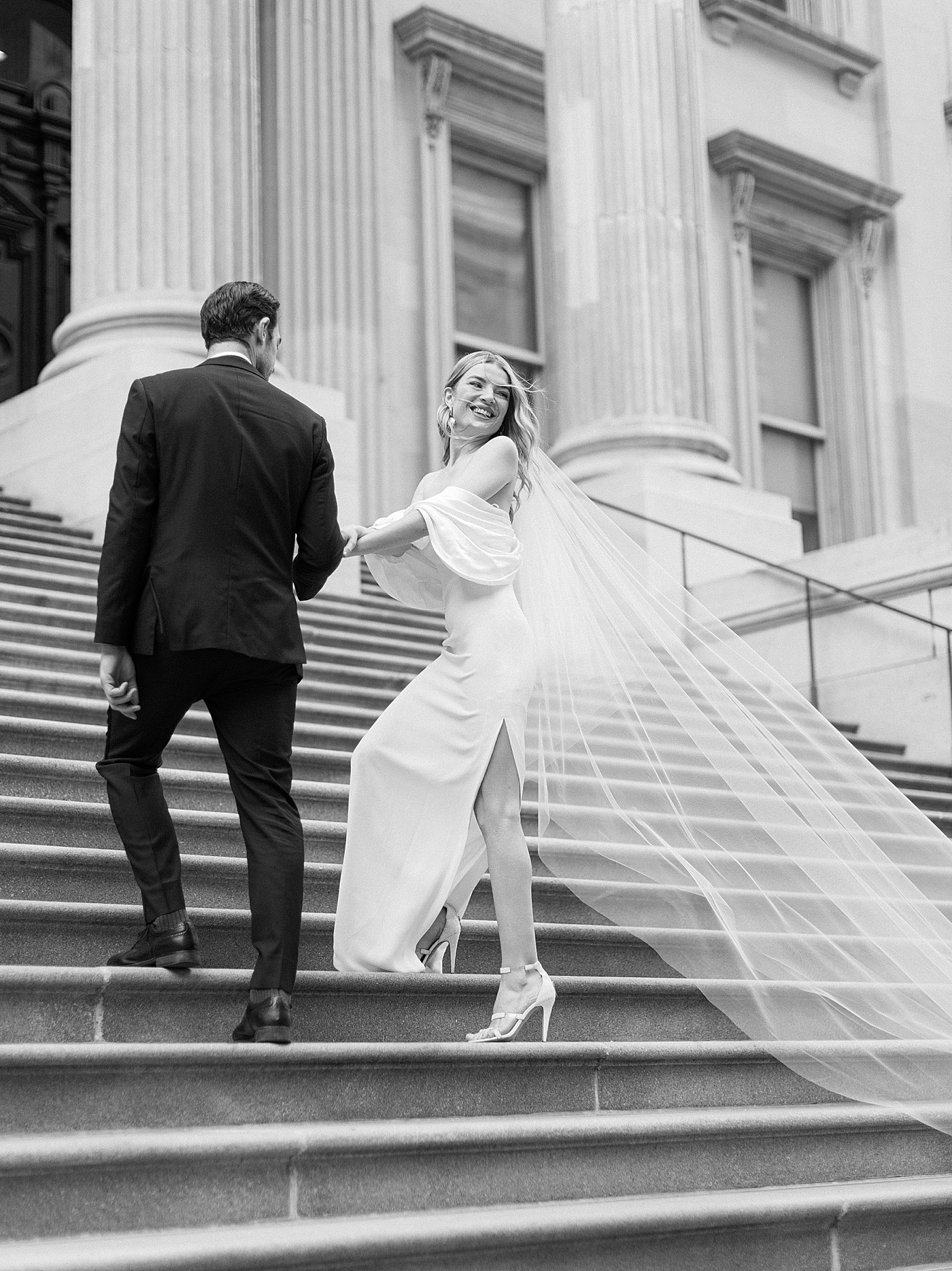 Groom and bride walking into the Ritz NYC | Photo by Hope Helmuth Photography