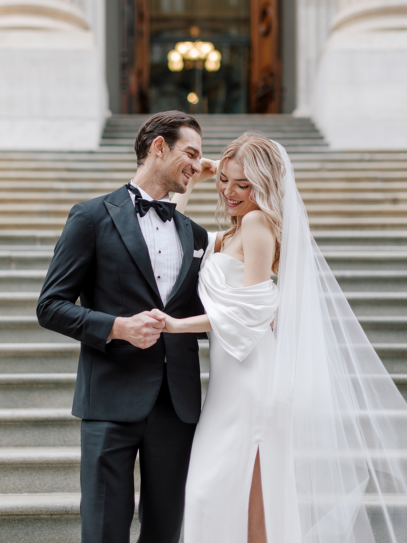 Playful bride and groom portraits in downtown NYC | Photo by Hope Helmuth Photography