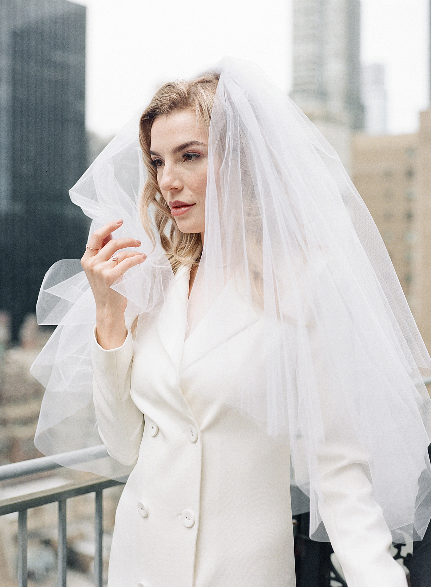 Bride with a white veil | Photo by Hope Helmuth Photography