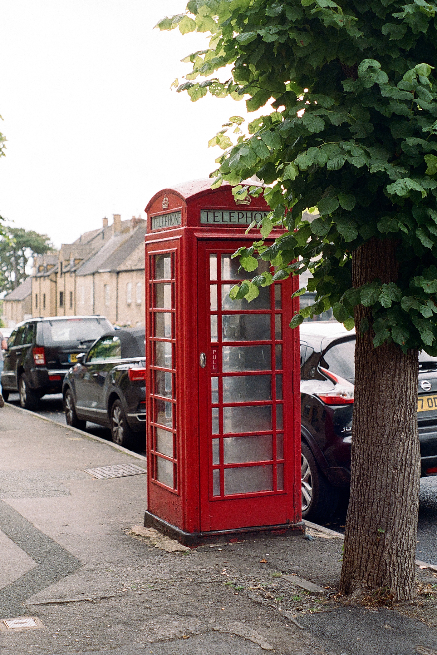 Red telephone booth in the Cotswolds | Photo by Cotswolds Wedding Photographer Hope Helmuth 