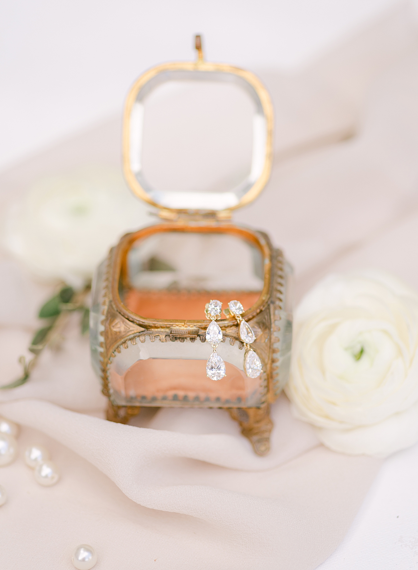 Bride's earrings in an antique glass box | Photo by Hope Helmuth Photography