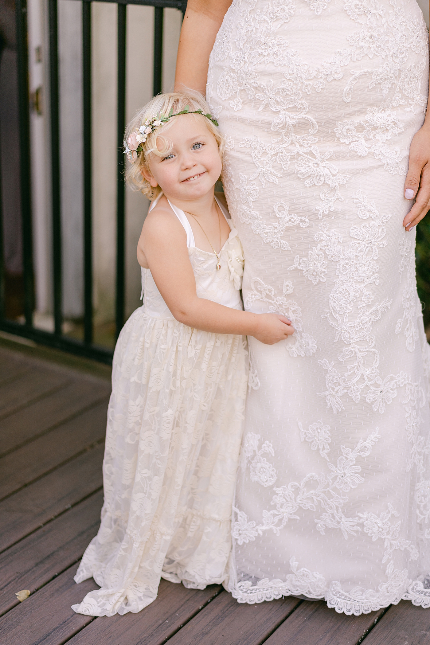 Flower girl smiling with bride | Photo by Hope Helmuth Photography