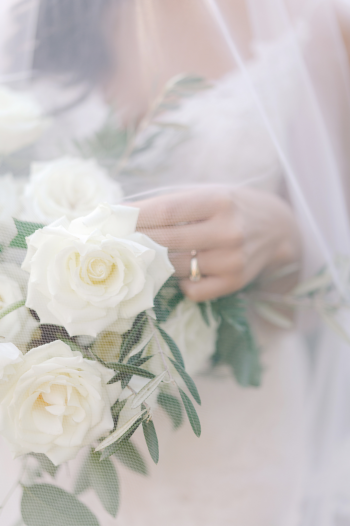 Details of bridal bouquet under veil | Photo by Hope Helmuth Photography