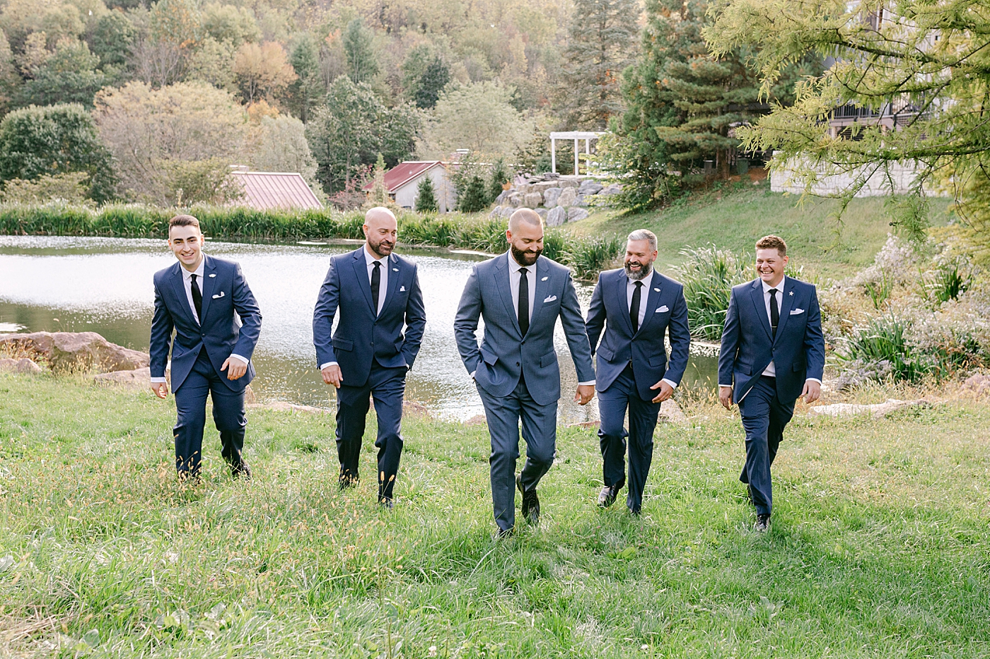 Groomsmen walking together | Photo by Hope Helmuth Photography