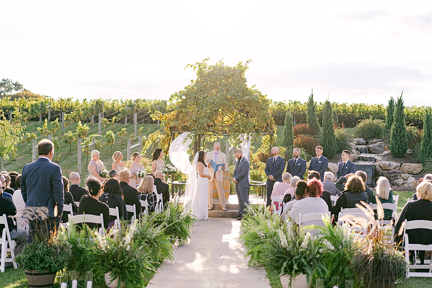 Bride and groom saying their vows at their folino estate wedding | Photo by Hope Helmuth Photography