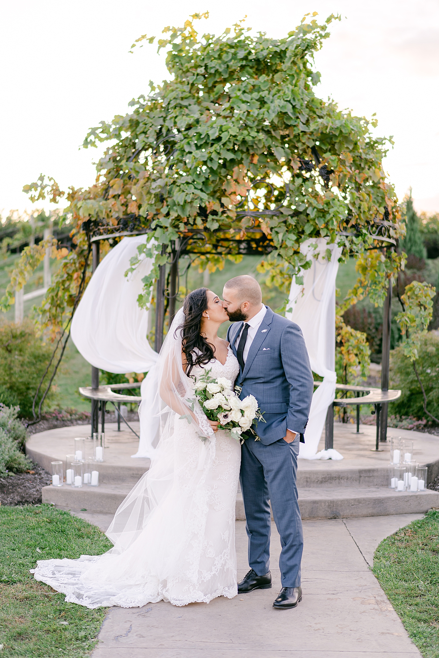 Bride and groom kissing during their folino estate wedding | Photo by Hope Helmuth Photography