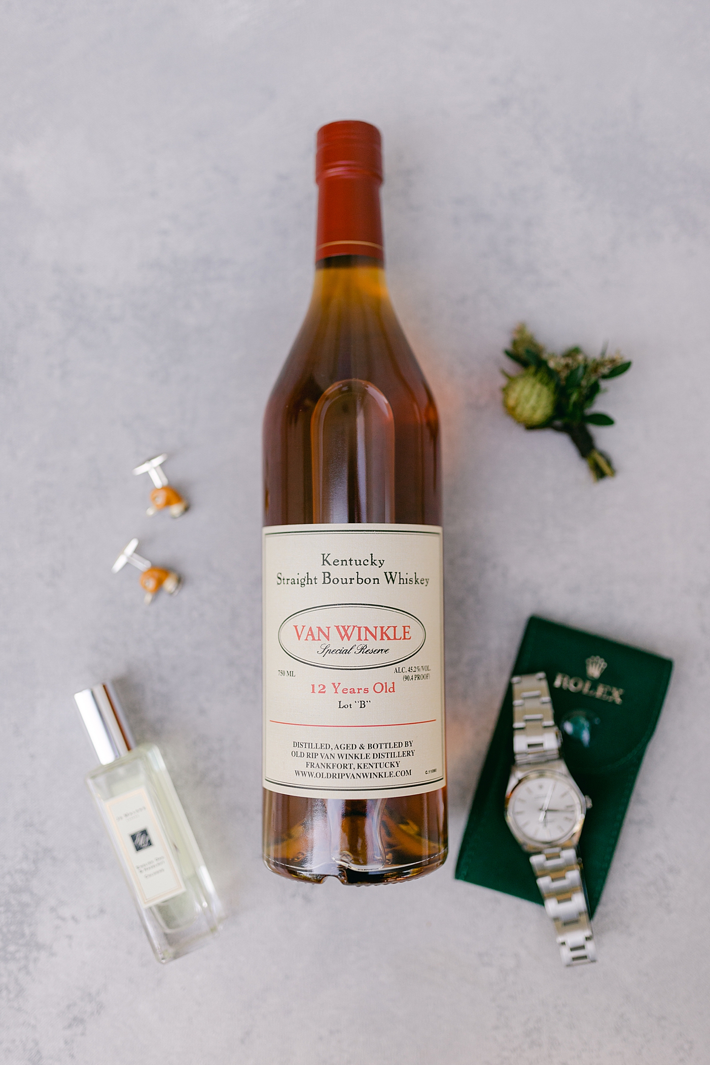 Bottle of bourbon styled with grooms details | Photo by Hope Helmuth Photography