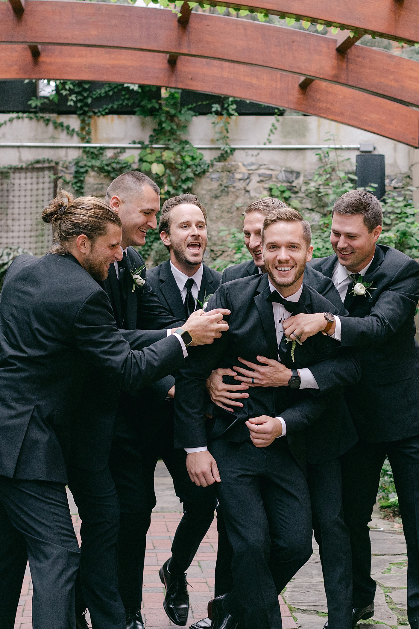 Groom and groomsmen laughing | Excelsior PA Wedding Photography by Hope Helmuth Photography