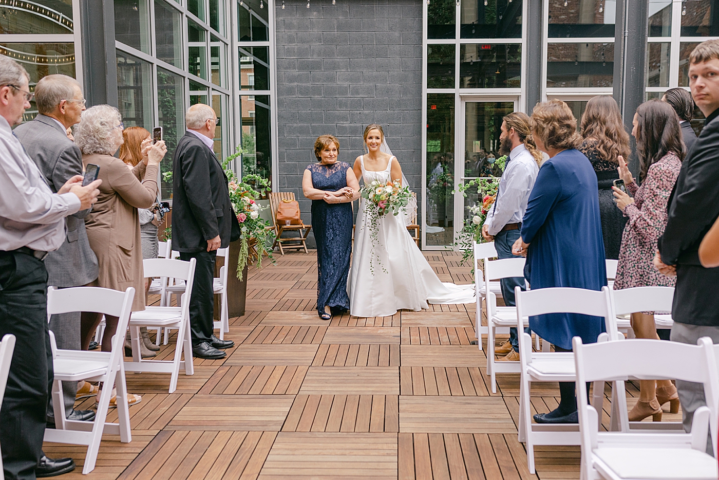 Bride walking down the aisle | Photo by Hope Helmuth Photography