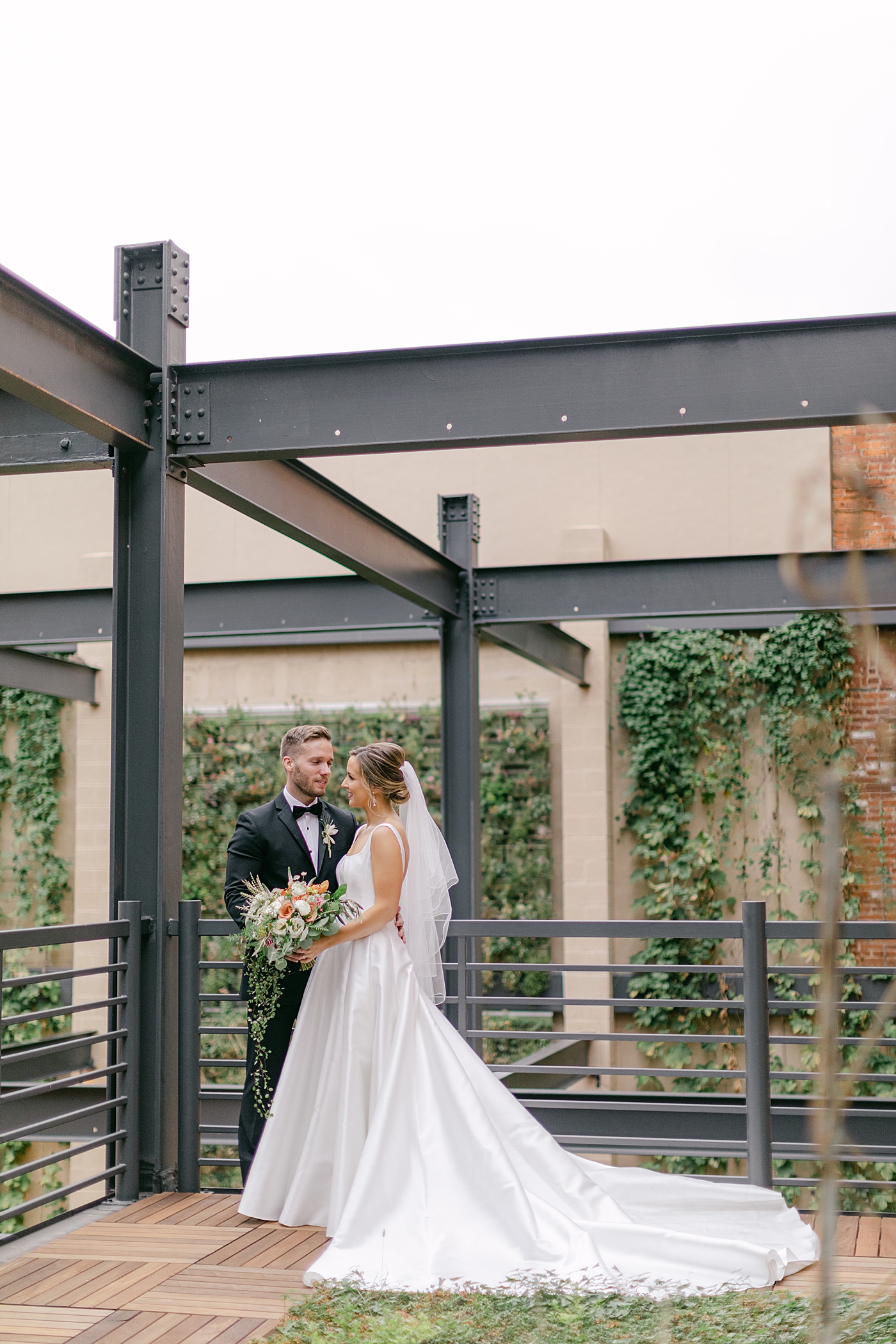 Bride and groom kissing on a rooftop | Excelsior PA Wedding Photography by Hope Helmuth Photography