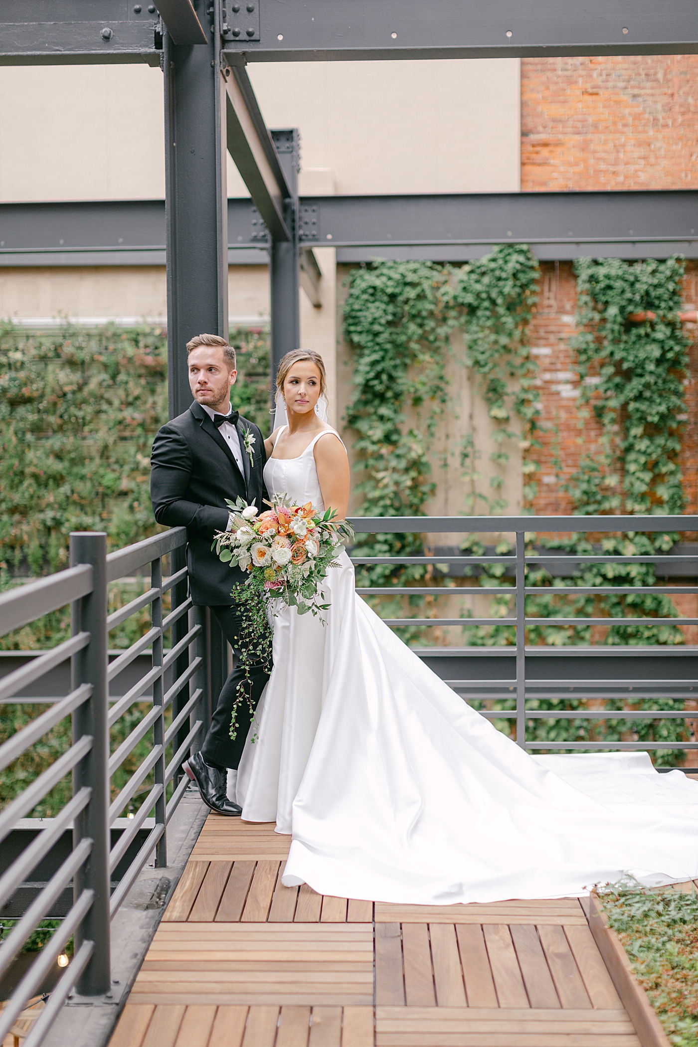 Bride and groom posing for portraits | Photo by Hope Helmuth Photography