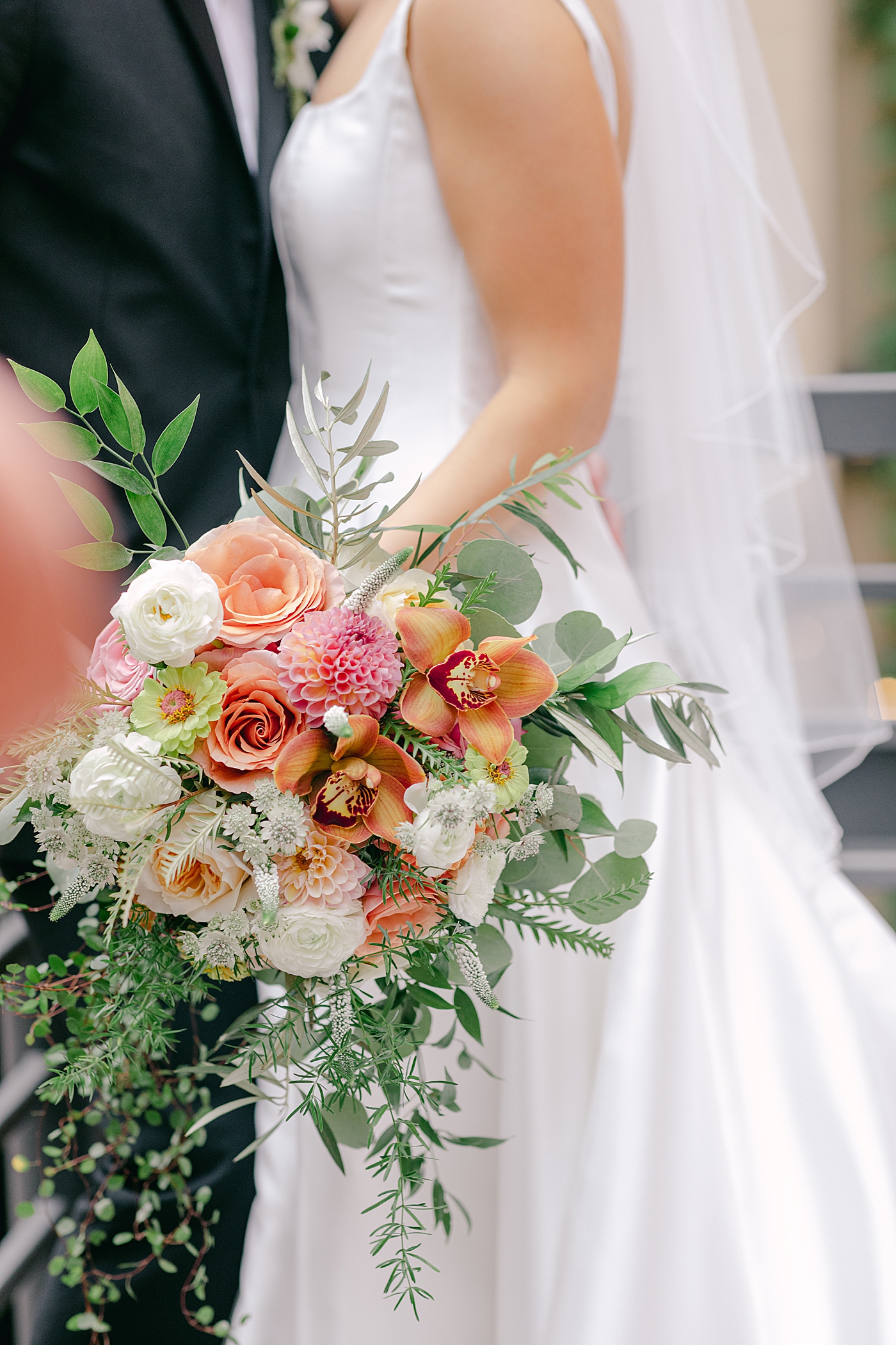Detail of colorful bridal bouquet held by bride | Photo by Hope Helmuth Photography