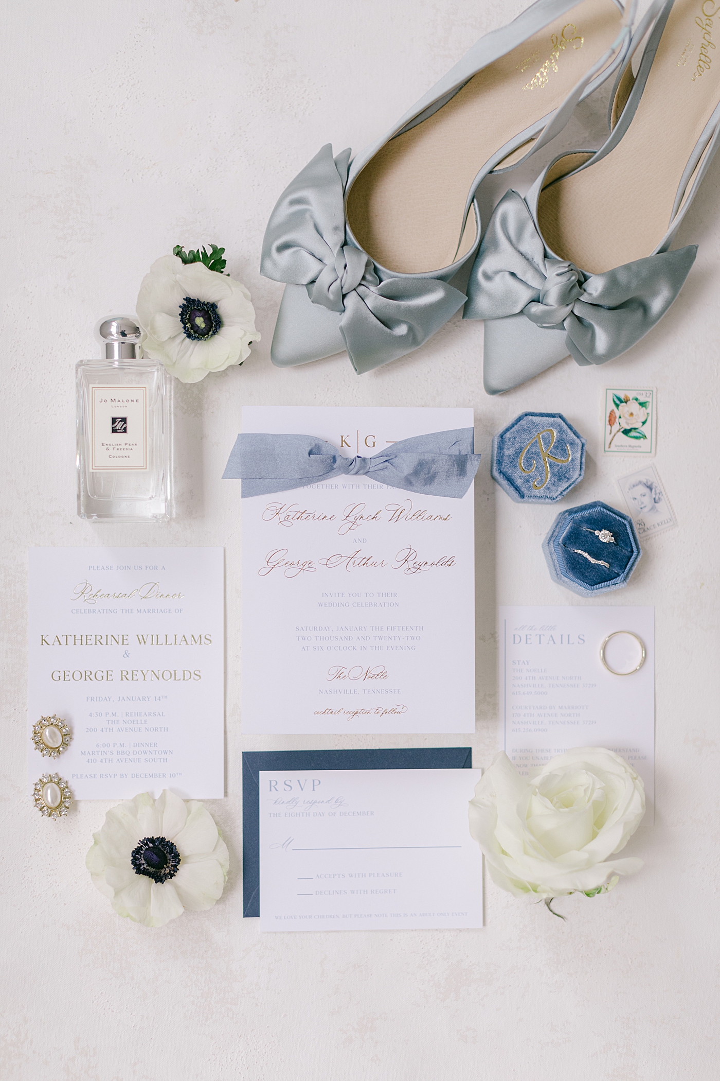 Wedding invitation styled with bride's blue shoes and ring box | Photo by Hope Helmuth Photography