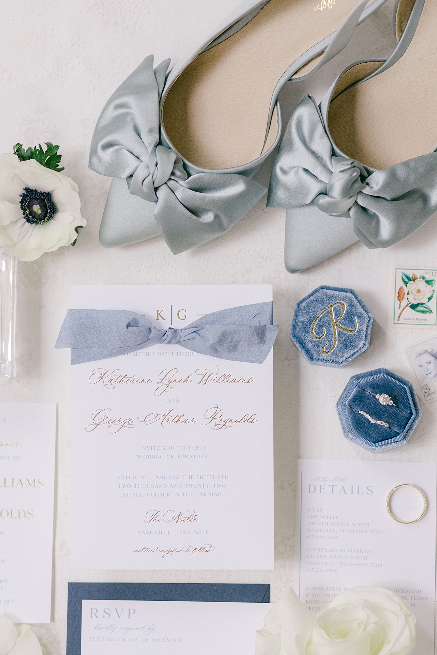Blue bridal shoes with a wedding invitation and flowers | Photo by Hope Helmuth Photography