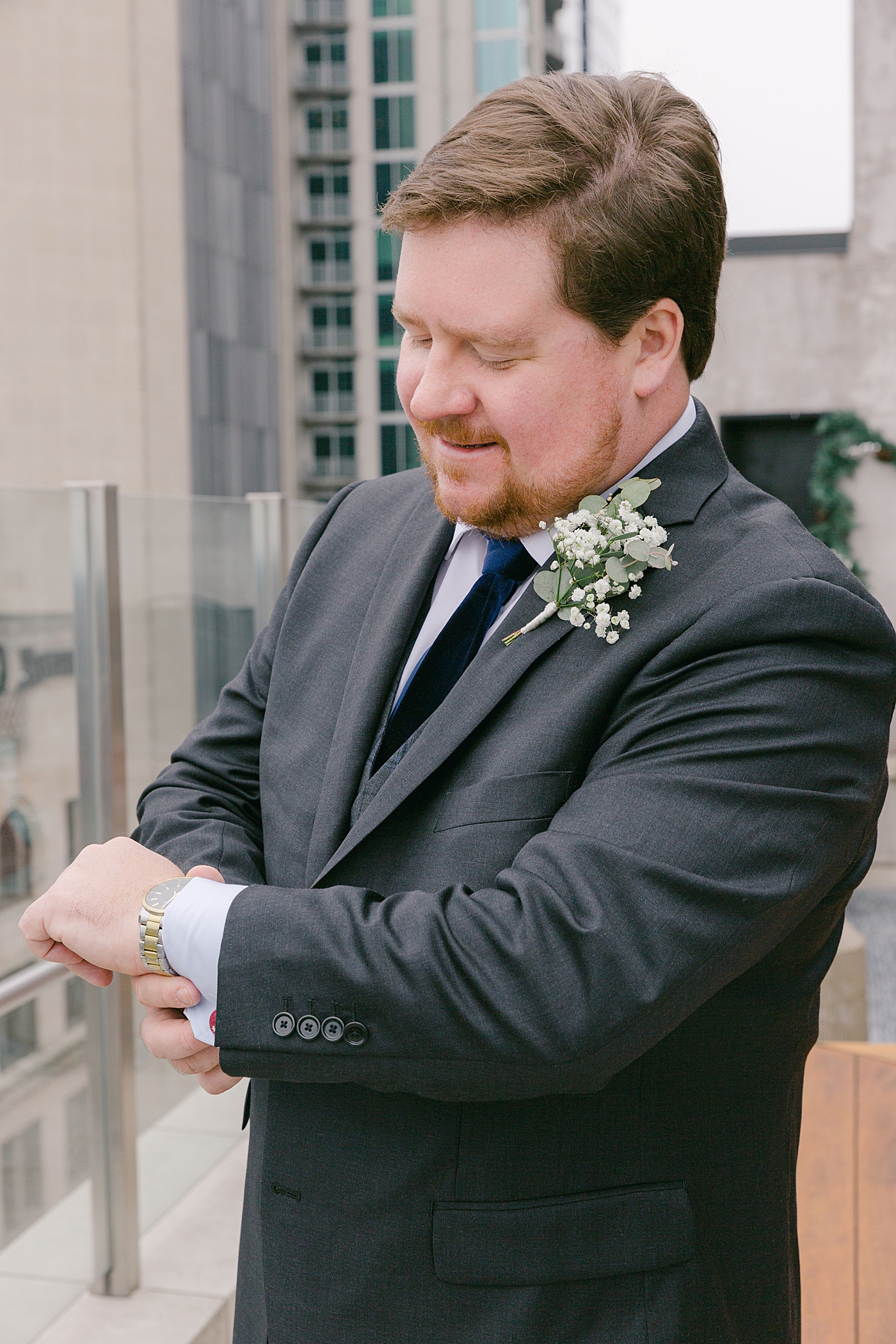 Groom adjusting his cufflinks | Photo by Hope Helmuth Photography