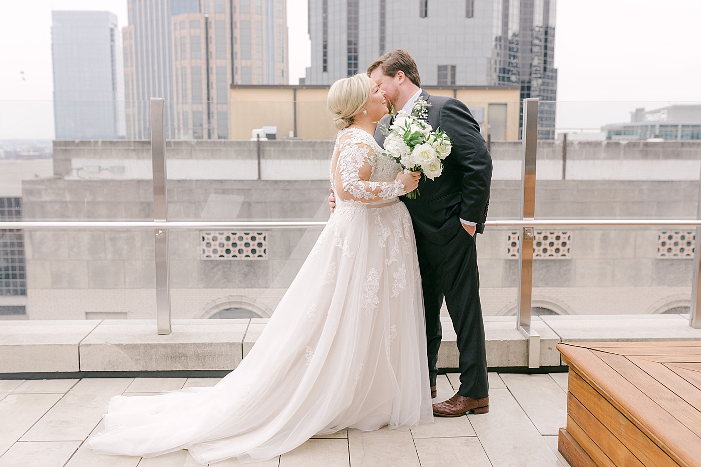 Bride and groom portraits on a rooftop | Photo by Hope Helmuth Photography