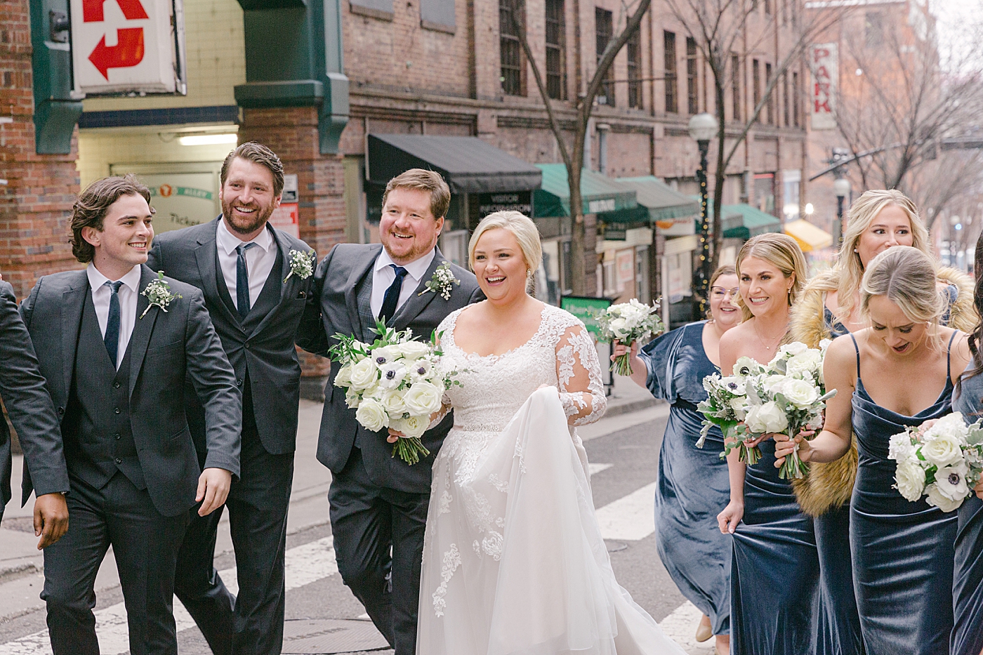 Bride and groom with wedding party during Noelle, Nashville Wedding | Photo by Hope Helmuth Photography