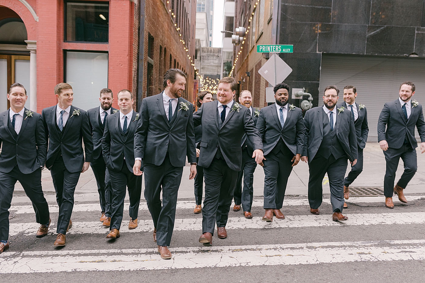 Groomsmen walking near Printers Alley | Photo by Hope Helmuth Photography