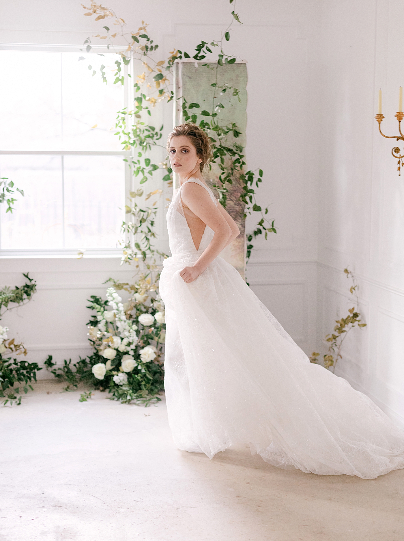 bride walking through the frame in a long white dress | Photo by Hope Helmuth Photograpghy
