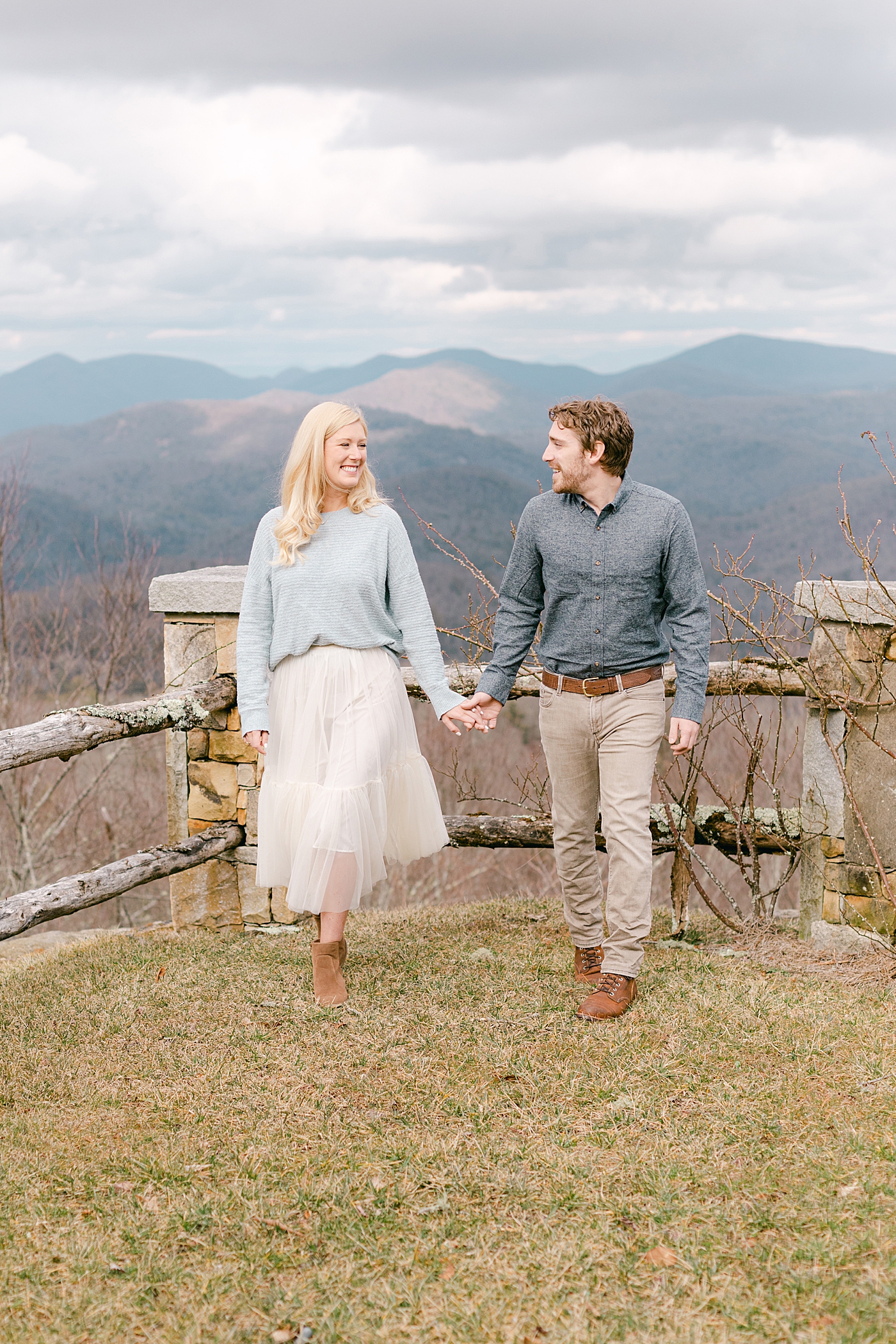 Couple holding hands walking in the mountains | Image by Hope Helmuth Photography