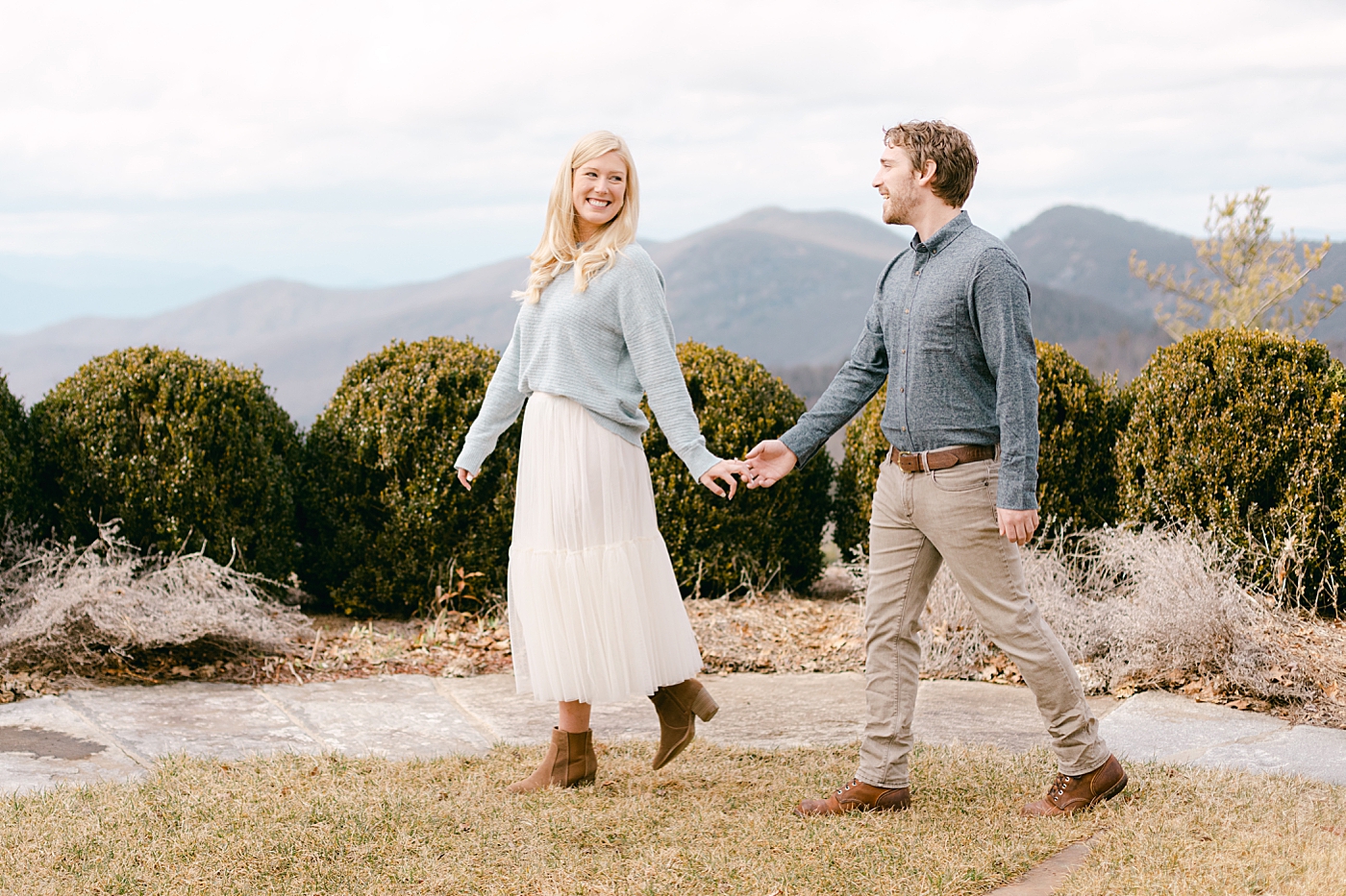Couple holding hands in the mountains | Image by Hope Helmuth Photography
