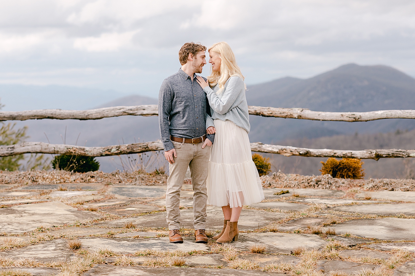Couple posing together in the mountains during their Highlands Engagement Session | Image by Hope Helmuth Photography