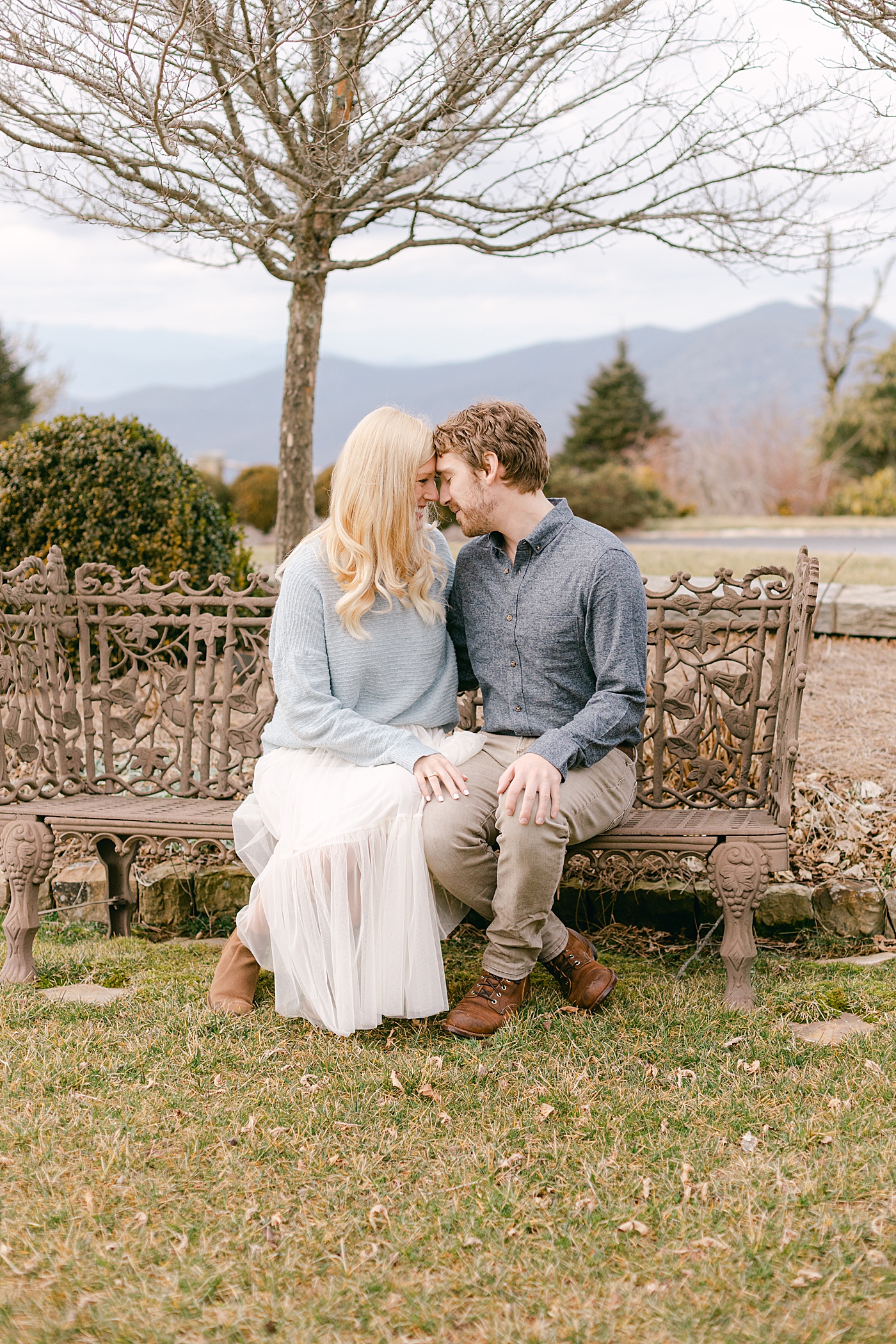 Couple sitting on a bench | Image by Hope Helmuth Photography