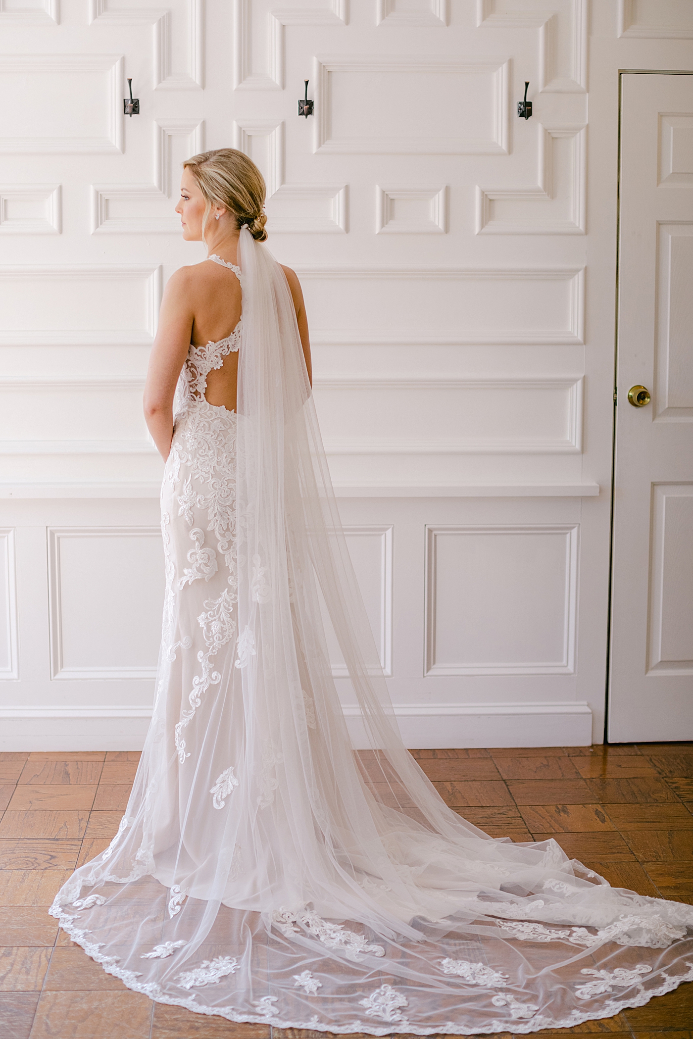 Bride looking out a window | Image by Hope Helmuth Photography