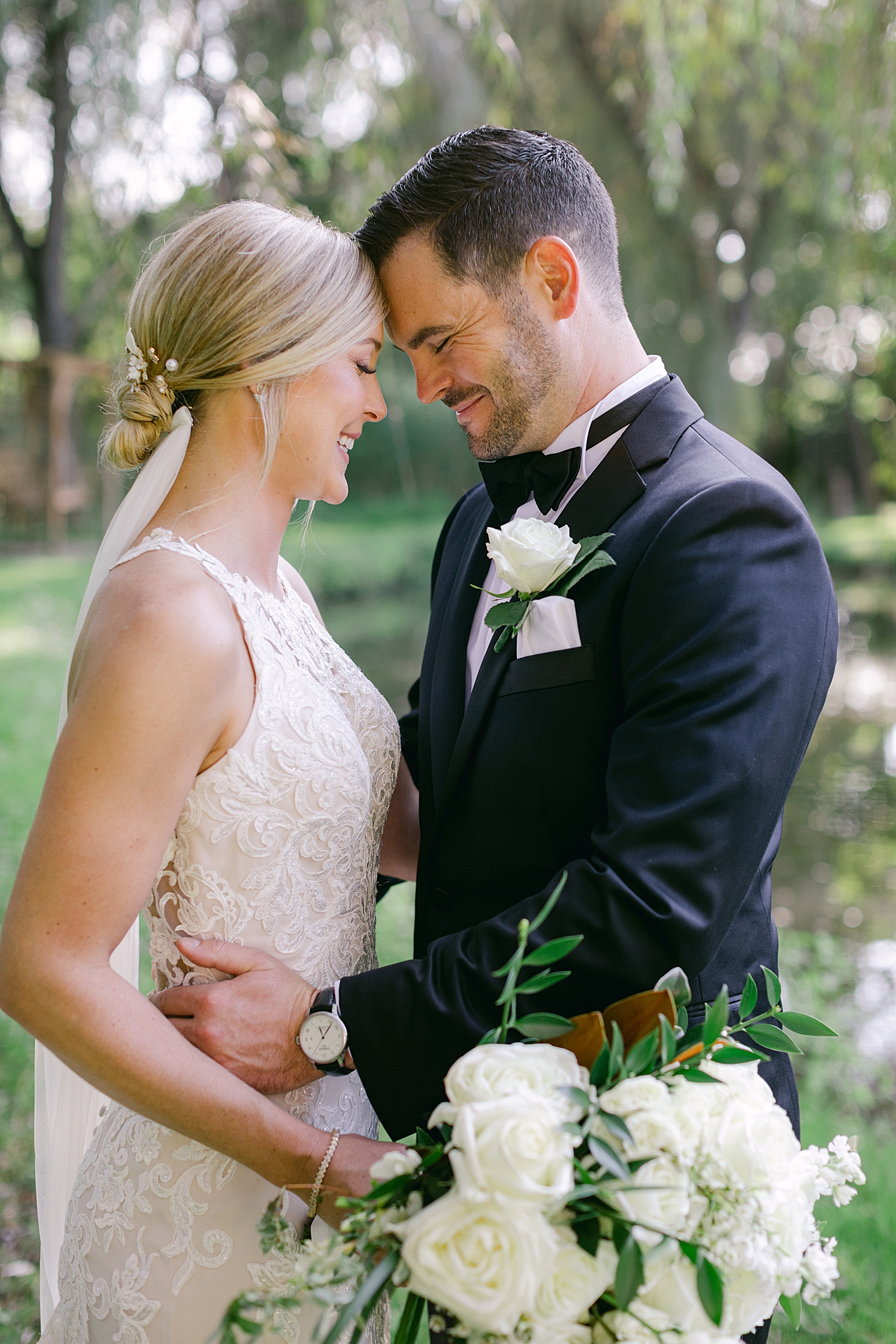 Bride and groom with their foreheads together during Hotel du Village Wedding | Image by Hope Helmuth Photography