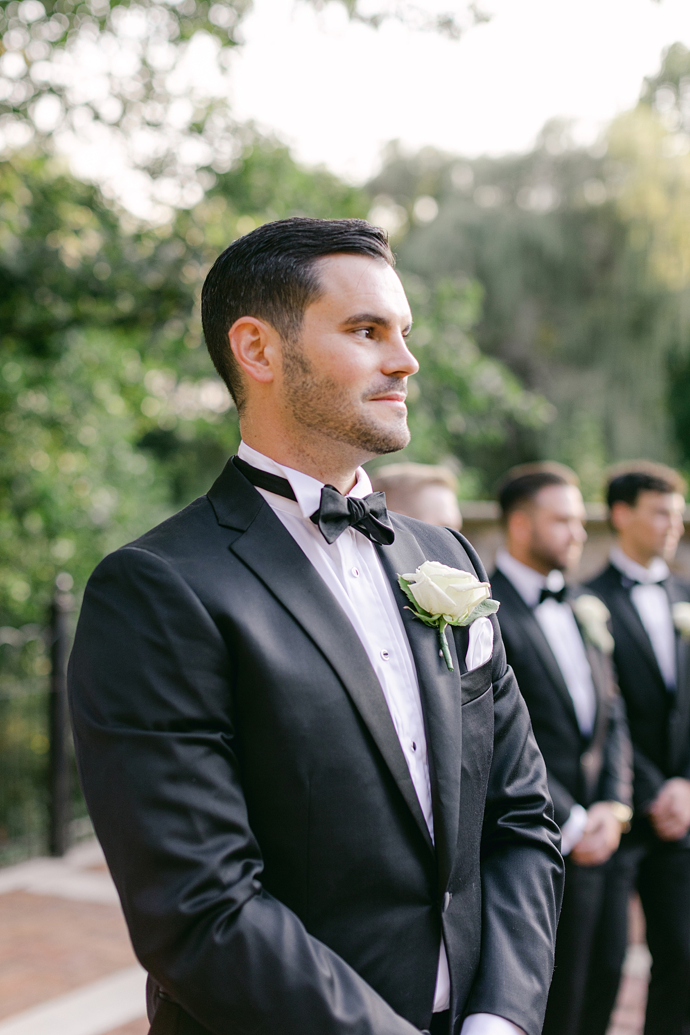 Groom waiting for bride walking down the aisle during Hotel du Village Wedding | Image by Hope Helmuth Photography