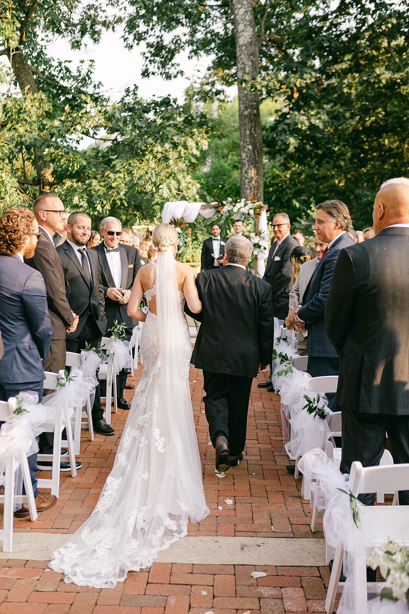 Bride walking down the aisle during Hotel du Village Wedding | Image by Hope Helmuth Photography