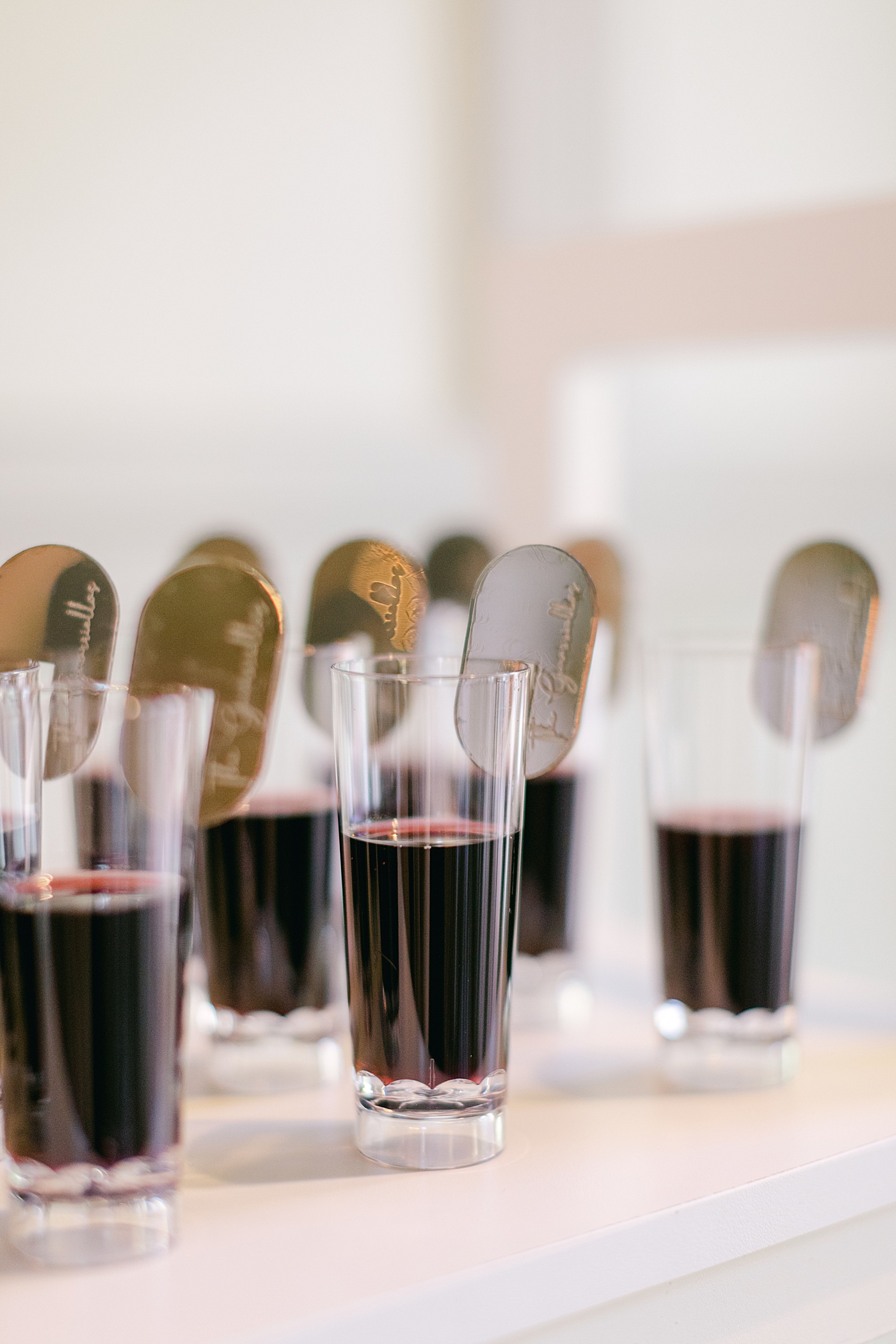 Wine in mini glasses during Hotel du Village Wedding | Image by Hope Helmuth Photography