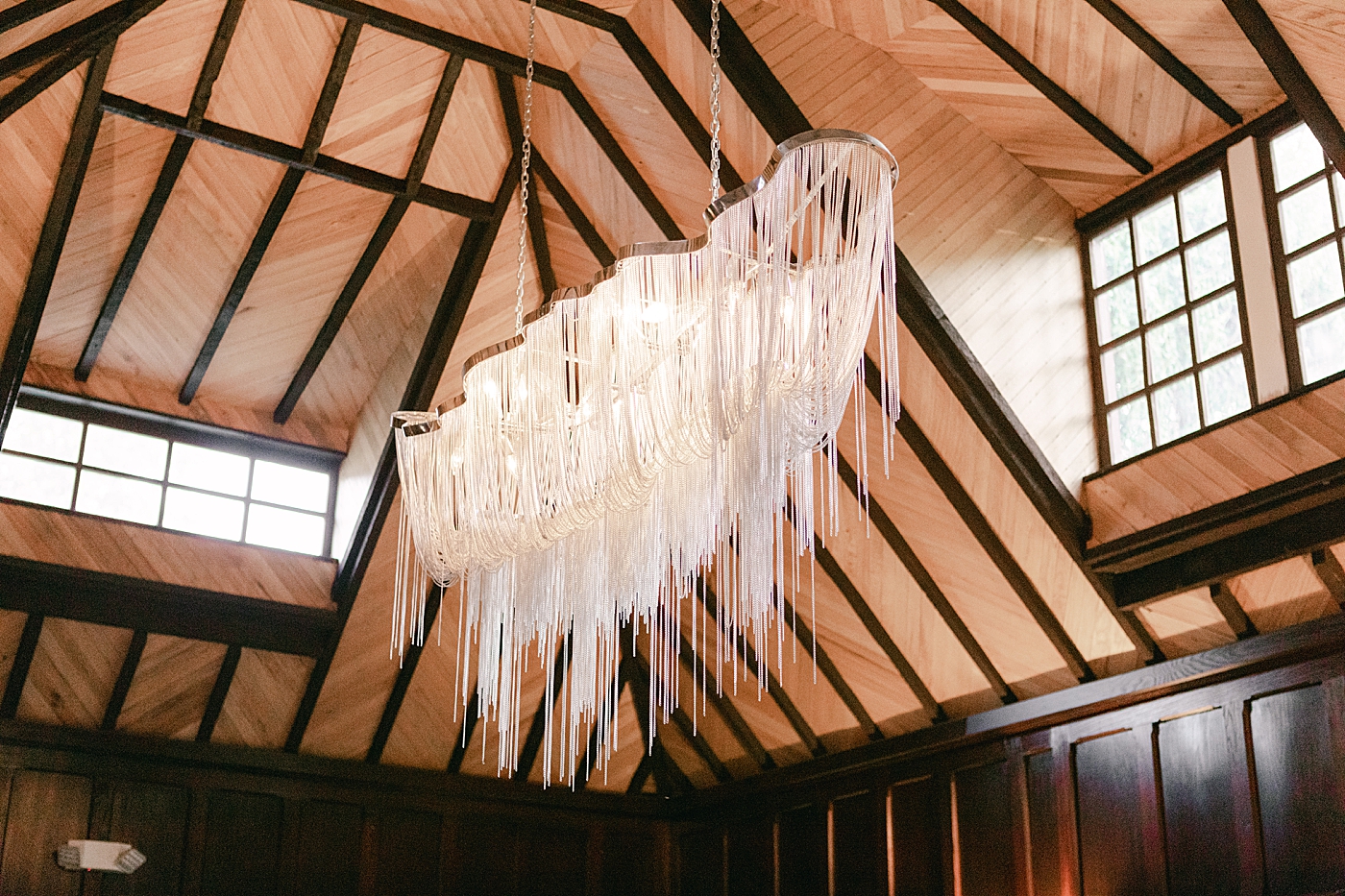 Chandelier at wedding venue during Hotel du Village Wedding | Image by Hope Helmuth Photography