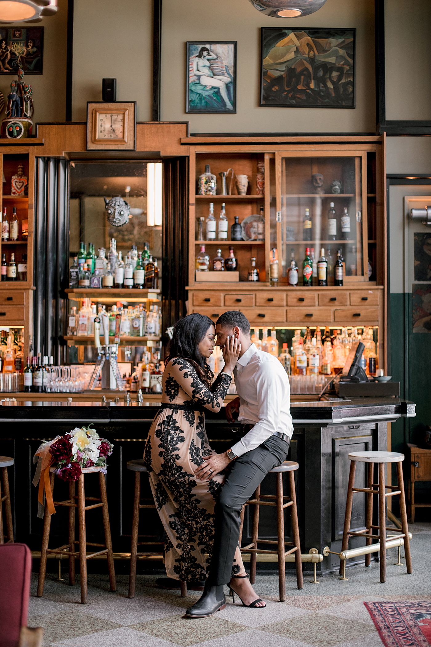 Couple sitting at a bar during their New Orleans Engagement Session | Photo by Hope Helmuth Photography