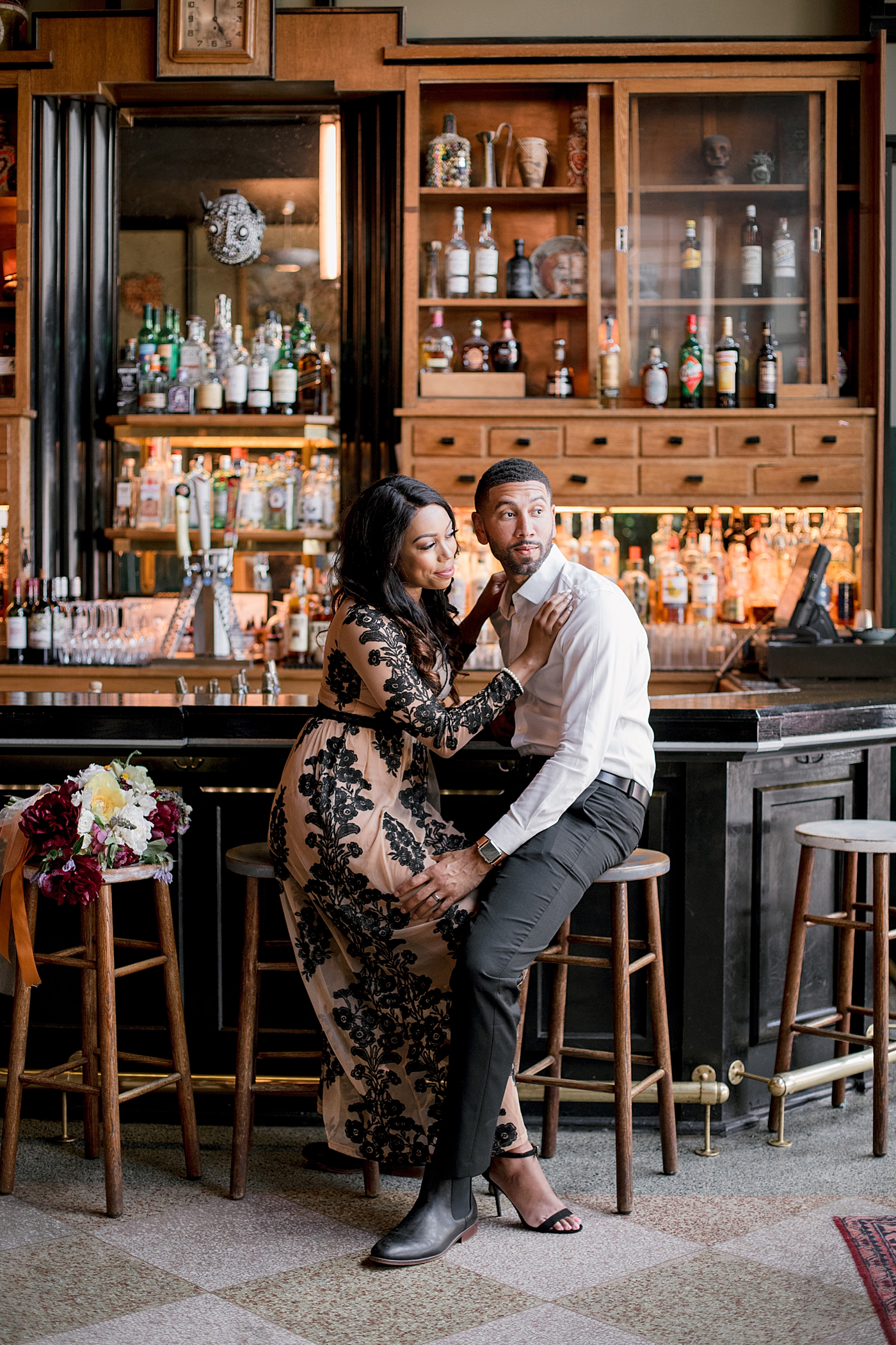 Couple sitting at a bar in the french quarter in new orleans | Photo by Hope Helmuth Photography