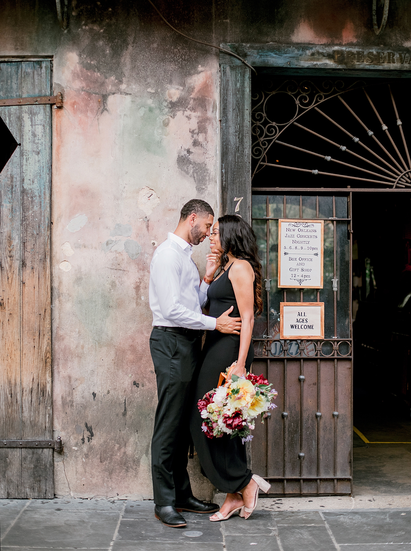 Couple snuggling in the french quarter | Photo by Hope Helmuth Photography