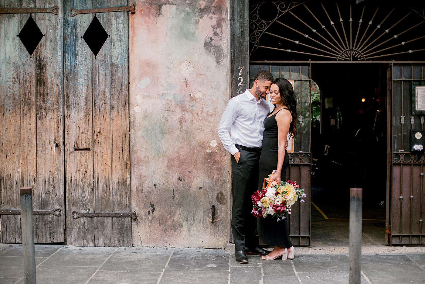 Couple posing together in the french quarter during their New Orleans Engagement Session | Photo by Hope Helmuth Photography