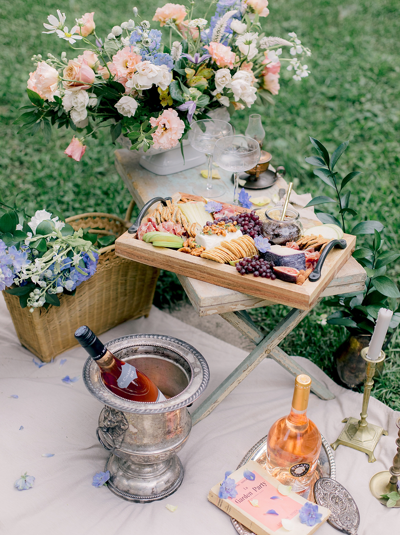 Charcuterie with rose and florals styled for a picnic | Image by Hope Helmuth Photography