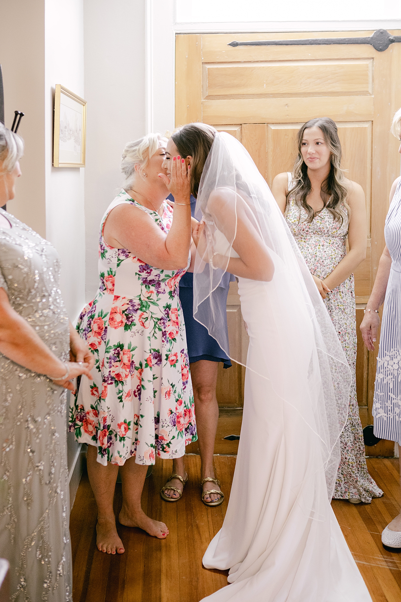 Bride greeting her family | Image by Hudson Valley Wedding Photographer Hope Helmuth