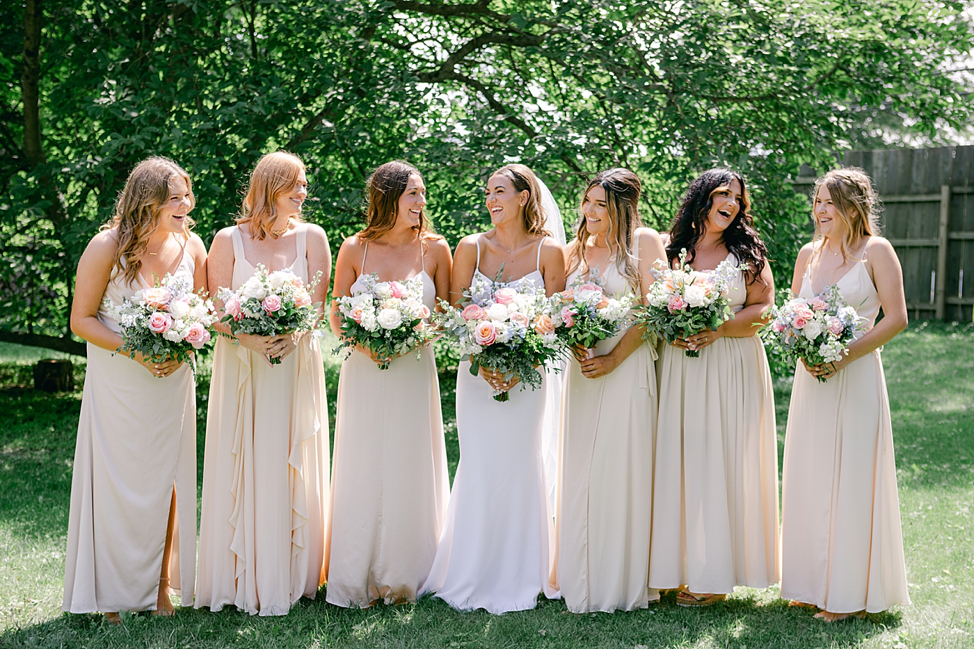 Bride walking with her bridesmaids | Image by Hudson Valley Wedding Photographer Hope Helmuth