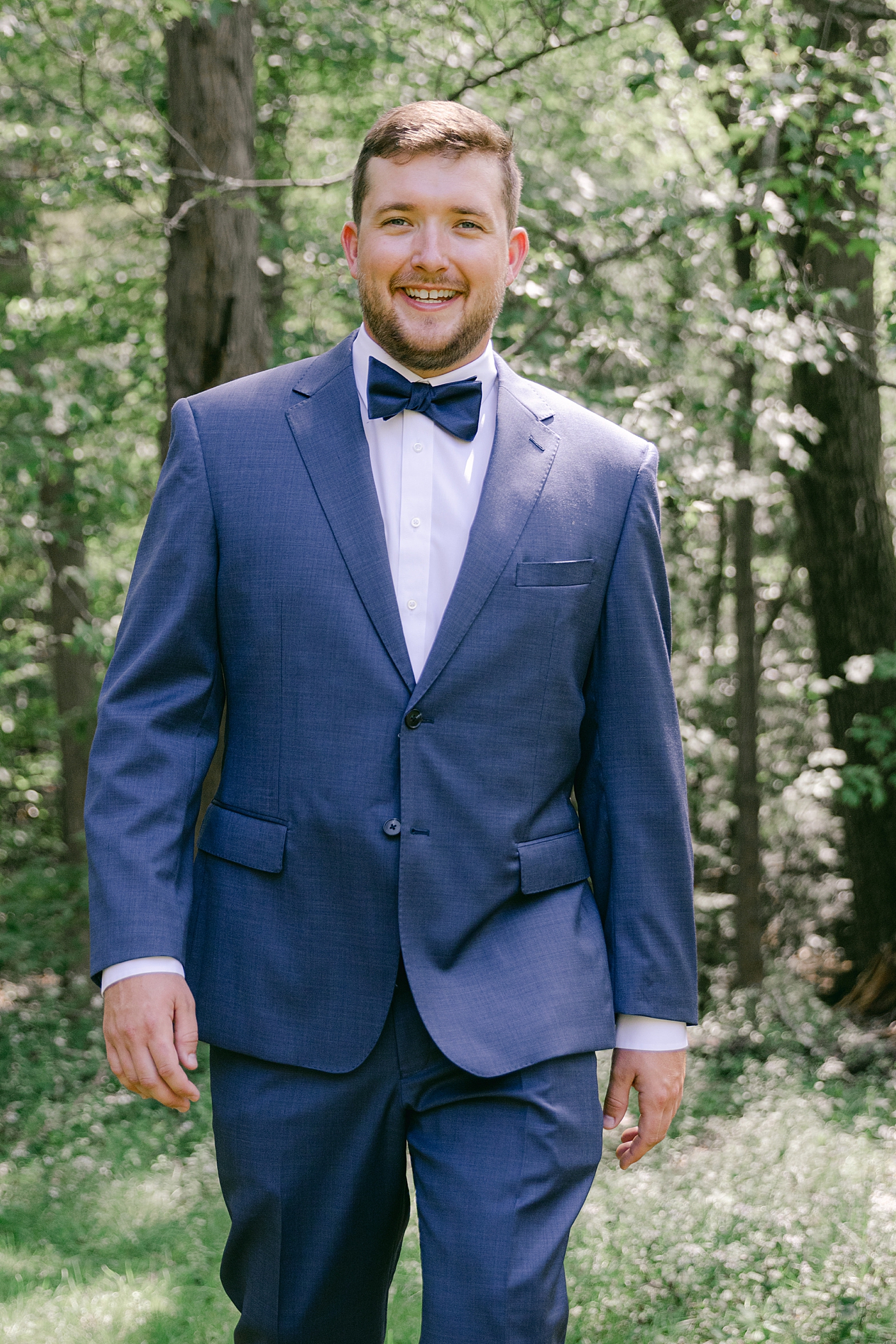Groom smiling | Image by Hope Helmuth Photography