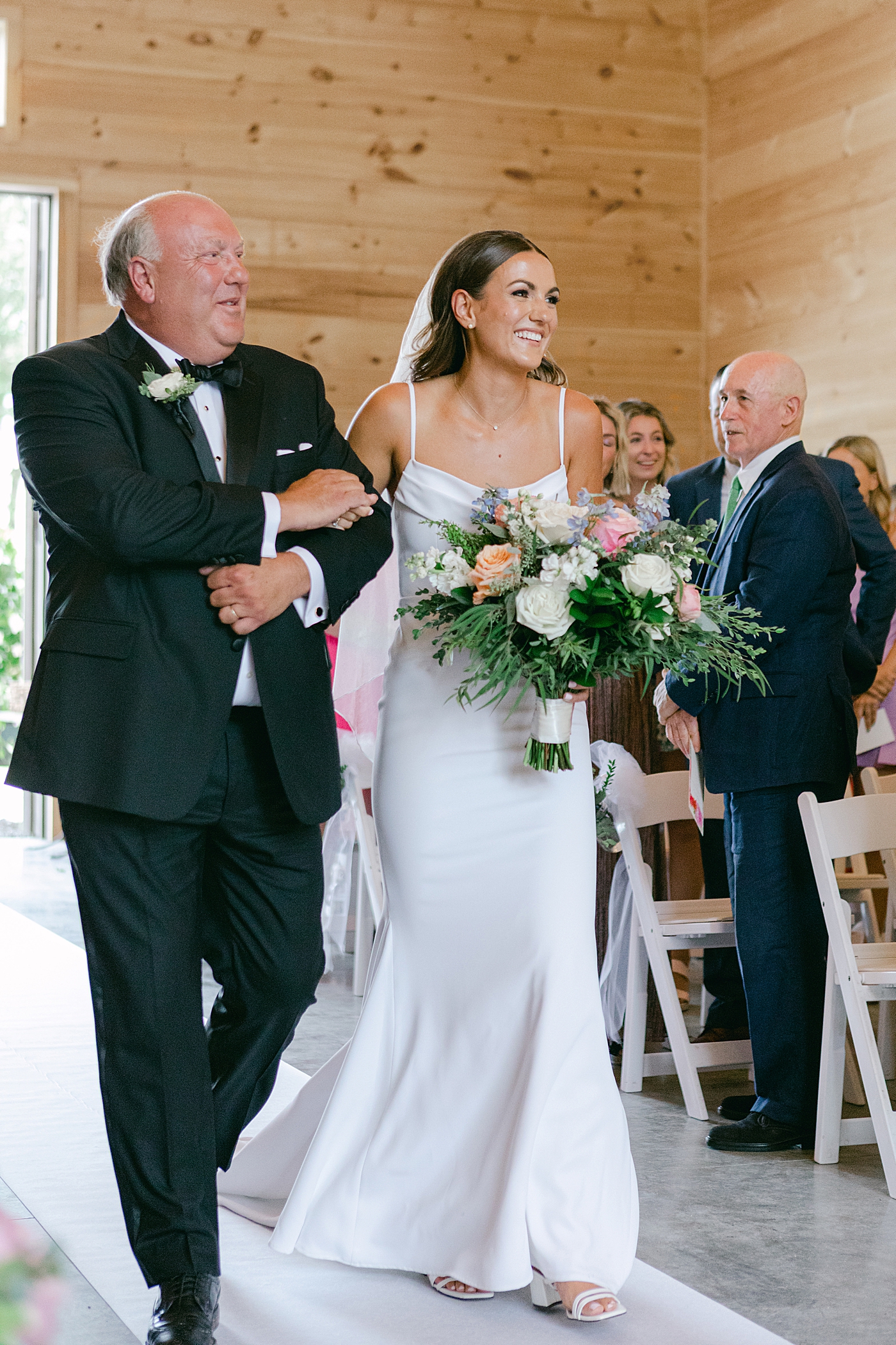 Bride walking down the aisle | Image by Hope Helmuth Photography