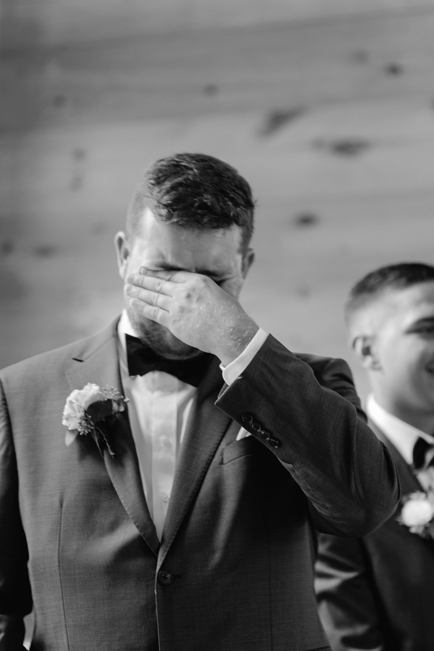 Black and white image of groom crying | Image by Hudson Valley Wedding Photographer Hope Helmuth