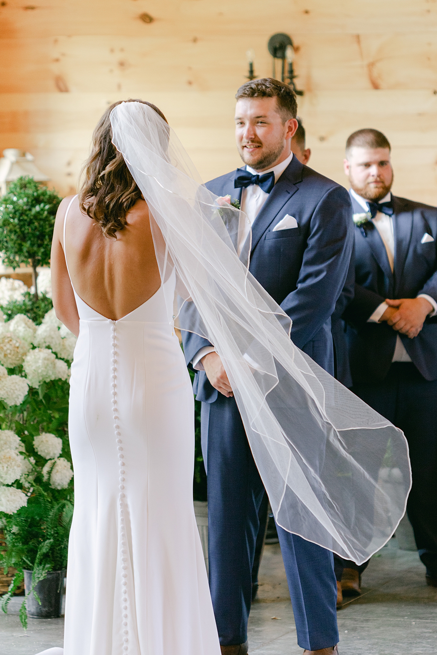 Bride and groom exchanging vows | Image by Hope Helmuth Photography