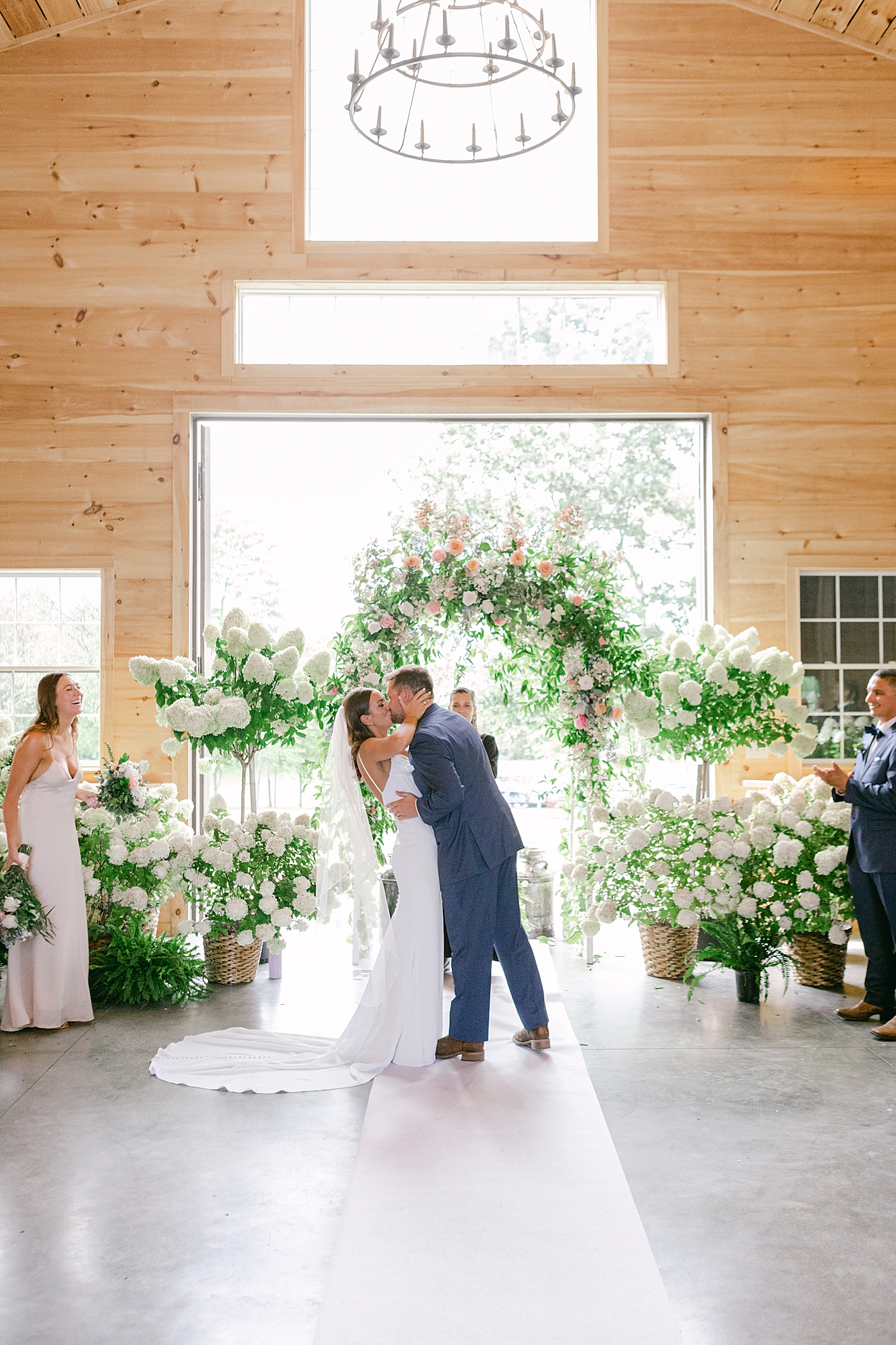 Bride and groom first kiss | Image by Hudson Valley Wedding Photographer Hope Helmuth