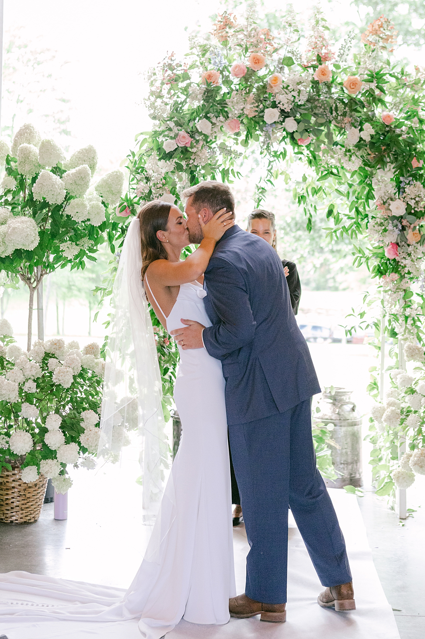 Bride and groom first kiss | Image by Hope Helmuth Photography